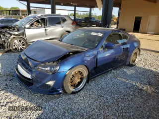 2013 Scion FR-S z VIN JF1ZNAA19D1722305, wystawiony jako Copart lot #51548445 z przebiegiem 101 284 mil mil oraz Czysty tytuł • Clean title. Historia ofert i sprzedaży dostępna na DreamBid. Obrazek 1.