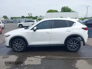 2018 Mazda CX-5 Touring with VIN JM3KFBCMXJ0366008, listed as a IAAI auction lot 42079989 with 153,868 mi miles and . Bid and sale history available at DreamBid. Image 14.