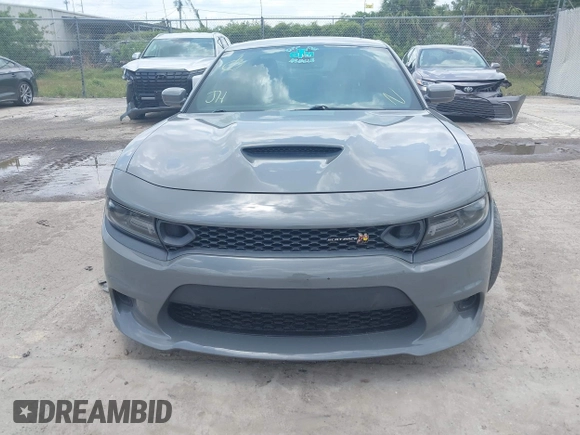 2019 Dodge Charger Scat Pack with VIN 2C3CDXGJ2KH633854, listed as a IAAI auction lot 42212517 with 74,285 mi miles and . Bid and sale history available at DreamBid. Image 6.