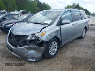 2015 Toyota Sienna XLE with VIN 5TDYK3DC7FS659864, listed as a IAAI auction lot 41958112 with 121,257 mi miles and . Bid and sale history available at DreamBid. Image 2.