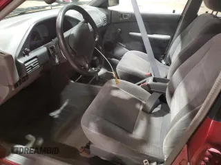 1995 Ford Escort z VIN 3FASP13J2SR157861, wystawiony jako Copart lot #82770964 z przebiegiem 48 610 mil mil oraz Szkoda całkowita • Salvage title. Historia ofert i sprzedaży dostępna na DreamBid. Obrazek 7.