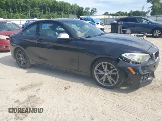 2015 BMW 2 Series M235i with VIN WBA1J7C5XFV253790, listed as a Copart auction lot 57155255 with 136,967 mi miles and Salvage title. Bid and sale history available at DreamBid. Image 4.