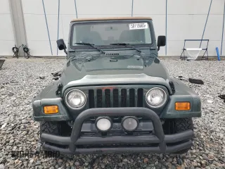 2002 Jeep Wrangler Sahara with VIN 1J4FA59S52P763290, listed as a Copart auction lot 59115665 with 129,479 mi miles and Non repairable. Bid and sale history available at DreamBid. Image 5.