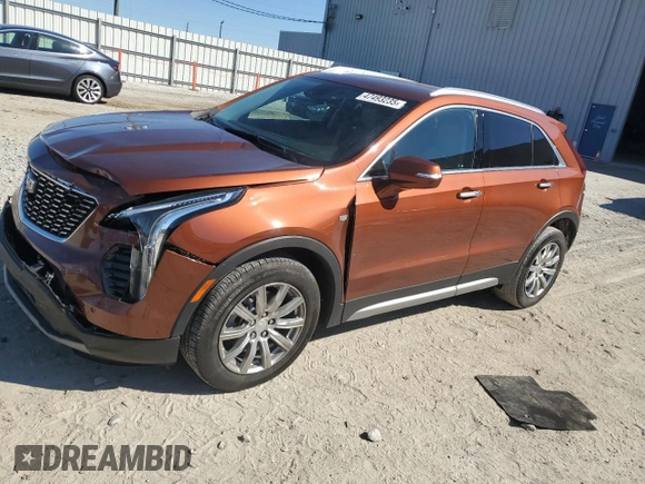 2021 Cadillac XT4 FWD Premium Luxury z VIN 1GYFZCR46MF076066, wystawiony jako Copart lot #47493235 z przebiegiem 21 550 mil mil oraz Nie do naprawy. Historia ofert i sprzedaży dostępna na DreamBid. Obrazek 1.