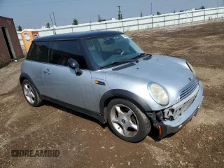 2004 MINI Hardtop with VIN WMWRC33454TJ56308, listed as a Copart auction lot 59690865 with 99,374 mi miles and Salvage title. Bid and sale history available at DreamBid. Image 4.