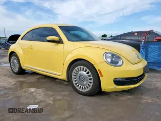 2014 Volkswagen Beetle 2.5L with VIN 3VWJX7AT2EM610372, listed as a Copart auction lot 60163345 with 121,497 mi miles and Salvage title. Bid and sale history available at DreamBid. Image 4.
