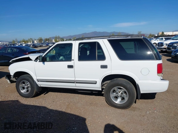 2001 Chevrolet Blazer LT z VIN 1GNCS13W712122865, wystawiony jako IAAI lot #41997035 z przebiegiem 161 862 mil mil oraz . Historia ofert i sprzedaży dostępna na DreamBid. Obrazek 14.