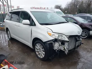 2015 Toyota Sienna Ltd with VIN 5TDDK3DC9FS115784, listed as a IAAI auction lot 41355934 with 125,675 mi miles. Bid and sale history available at carsss.com. Image 1.