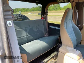 1999 Jeep Wrangler Sahara with VIN 1J4FY49S5XP496486, listed as a Copart auction lot 54989365 with 128,498 mi miles and Clean Title. Bid and sale history available at carsss.com. Image 6.