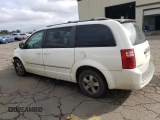 2010 Dodge Grand Caravan SXT with VIN 2D4RN5D11AR331804, listed as a Copart auction lot 73735873 with 183,923 mi miles and Salvage Title. Bid and sale history available at DreamBid. Image 2.