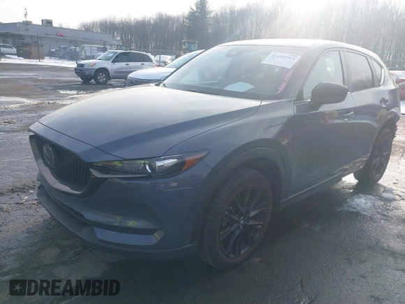 2021 Mazda CX-5 Touring z VIN JM3KFBCMXM0463469, wystawiony jako IAAI lot #41488993 z przebiegiem 28 582 mil mil oraz . Historia ofert i sprzedaży dostępna na DreamBid. Obrazek 2.