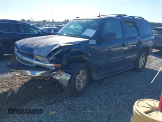 2005 Chevrolet Tahoe LT z VIN 1GNEC13T85J201856, wystawiony jako IAAI lot #41099372 z przebiegiem 303 169 mil mil oraz . Historia ofert i sprzedaży dostępna na DreamBid. Obrazek 2.