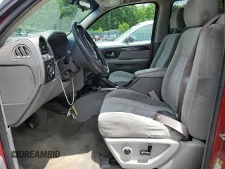2005 GMC Envoy SLE z VIN 1GKDT13S752203494, wystawiony jako Copart lot #56150605 z przebiegiem 243 475 mil mil oraz Szkody całkowita. Historia ofert i sprzedaży dostępna na DreamBid. Obrazek 7.