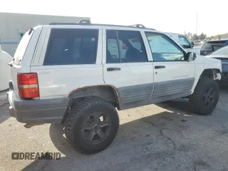 1998 Jeep Grand Cherokee Laredo with VIN 1J4GZ58S6WC319444, listed as a Copart auction lot 53147665 with 217,068 mi miles and Salvage Title. Bid and sale history available at carsss.com. Image 3.