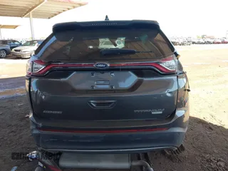 2015 Ford Edge Titanium z VIN 2FMTK3K90FBC12582, wystawiony jako IAAI lot #41860973 z przebiegiem Nie podano mil oraz . Historia ofert i sprzedaży dostępna na DreamBid. Obrazek 15.