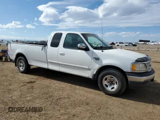 1999 Ford F-150 with VIN 2FTRX17L0XCA37979, listed as a Copart auction lot 58216695 with 256,055 mi miles and Clean title. Bid and sale history available at DreamBid. Image 4.