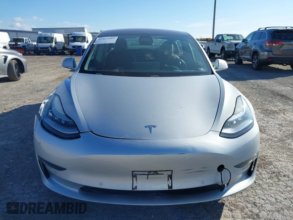 2018 Tesla Model 3 Long Range Battery with VIN 5YJ3E1EB9JF065057, listed as a IAAI auction lot 41863903 with 54,584 mi miles and . Bid and sale history available at DreamBid. Image 12.