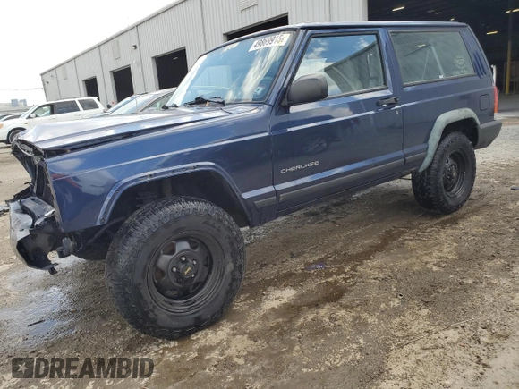 1997 Jeep Cherokee SE with VIN 1J4FT27P0VL612859, listed as a Copart auction lot 49869915 with 198,702 mi miles and Salvage title. Bid and sale history available at DreamBid. Image 1.