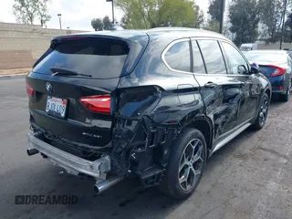 2019 BMW X1 sDrive28i with VIN WBXHU7C59K5L12320, listed as a IAAI auction lot 42116860 with 28,183 mi miles and . Bid and sale history available at DreamBid. Image 4.