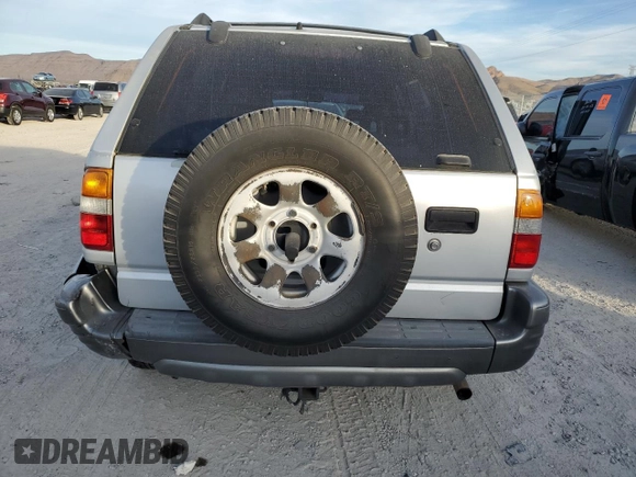 1999 Isuzu Rodeo S with VIN 4S2CK58W2X4361475, listed as a Copart auction lot 63873864 with 232,406 mi miles and Salvage Title. Bid and sale history available at DreamBid. Image 6.