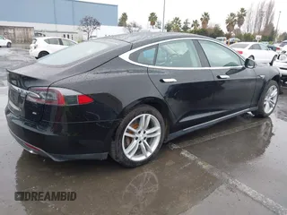 2013 Tesla Model S with VIN 5YJSA1CN0DFP20053, listed as a IAAI auction lot 41470660 with 61,568 mi miles and . Bid and sale history available at DreamBid. Image 4.