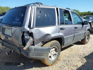 1996 Jeep Grand Cherokee Laredo with VIN 1J4GZ58S1TC168797, listed as a IAAI auction lot 41983746 with 1 mi miles. Bid and sale history available at carsss.com. Image 4.