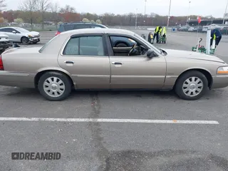 2003 Mercury Grand Marquis LS Premium z VIN 2MEFM75W73X653224, wystawiony jako IAAI lot #42038256 z przebiegiem 145 374 mil mil oraz . Historia ofert i sprzedaży dostępna na DreamBid. Obrazek 13.