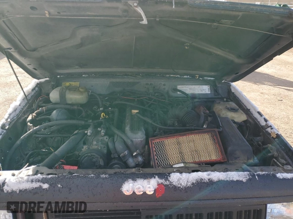 1990 Jeep Cherokee z VIN 1J4FJ28L1LL100736, wystawiony jako Copart lot #81339574 z przebiegiem 160 363 mil mil oraz Czysty tytuł • Clean title. Historia ofert i sprzedaży dostępna na DreamBid. Obrazek 11.