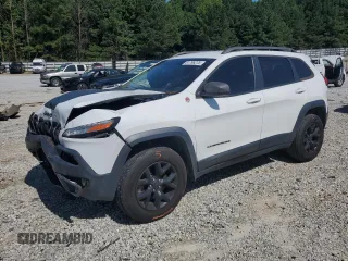 2015 Jeep Cherokee Trailhawk with VIN 1C4PJMBS0FW705288, listed as a Copart auction lot 61796275 with 133,874 mi miles and Salvage title. Bid and sale history available at DreamBid. Image 1.