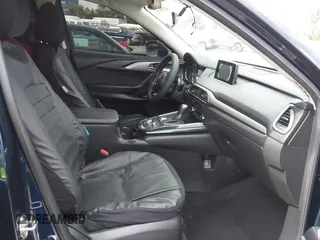 2016 Mazda CX-9 Sport with VIN JM3TCABY3G0123239, listed as a IAAI auction lot 42570700 with 119,414 mi miles and . Bid and sale history available at DreamBid. Image 5.