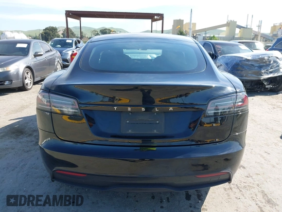 2023 Tesla Model S with VIN 5YJSA1E54PF531021, listed as a IAAI auction lot 42014104 with Not provided miles and . Bid and sale history available at DreamBid. Image 16.