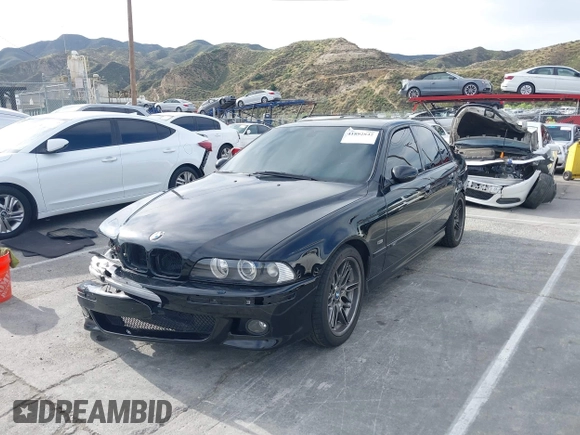 2001 BMW M5 z VIN WBSDE93421BZ99483, wystawiony jako IAAI lot #41892842 z przebiegiem 134 689 mil mil oraz . Historia ofert i sprzedaży dostępna na DreamBid. Obrazek 2.