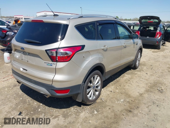 2017 Ford Escape Titanium with VIN 1FMCU9JD3HUC90273, listed as a IAAI auction lot 41828236 with 71,351 mi miles. Bid and sale history available at carsss.com. Image 4.