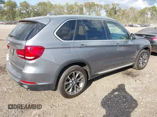 2014 BMW X5 xDrive35i with VIN 5UXKR0C52E0K50710, listed as a IAAI auction lot 40529606 with 114,307 mi miles. Bid and sale history available at carsss.com. Image 4.