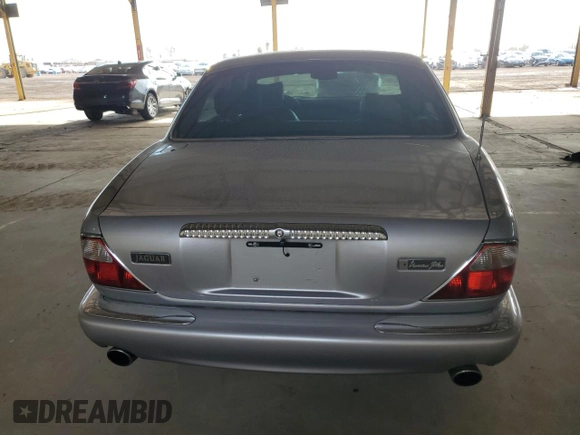 2000 Jaguar XJ with VIN SAJDA25B8YMF04079, listed as a Copart auction lot 50592595 with 131,647 mi miles and Salvage title. Bid and sale history available at DreamBid. Image 6.