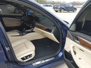 2018 BMW 5 Series M550i xDrive with VIN WBAJB9C56JG463891, listed as a IAAI auction lot 41731556 with 104,860 mi miles. Bid and sale history available at carsss.com. Image 5.