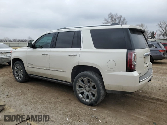 2015 GMC Yukon Denali with VIN 1GKS1CKJ1FR619793, listed as a Copart auction lot 86910314 with 128,559 mi miles and Salvage Title. Bid and sale history available at carsss.com. Image 2.