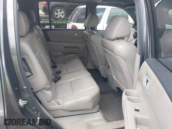 2012 Honda Pilot EX-L with VIN 5FNYF4H53CB026381, listed as a IAAI auction lot 41802360 with 165,425 mi miles and . Bid and sale history available at DreamBid. Image 8.