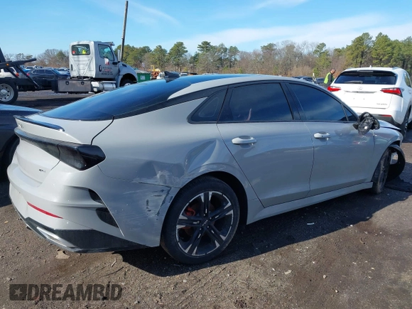 2023 Kia K5 GT-Line z VIN 5XXG64J28PG188506, wystawiony jako IAAI lot #41854184 z przebiegiem 18 967 mil mil oraz . Historia ofert i sprzedaży dostępna na DreamBid. Obrazek 4.