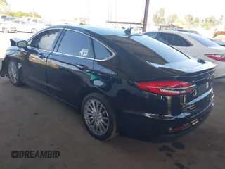 2020 Ford Fusion Titanium with VIN 3FA6P0RU8LR141324, listed as a IAAI auction lot 42004026 with 107,136 mi miles and . Bid and sale history available at DreamBid. Image 3.