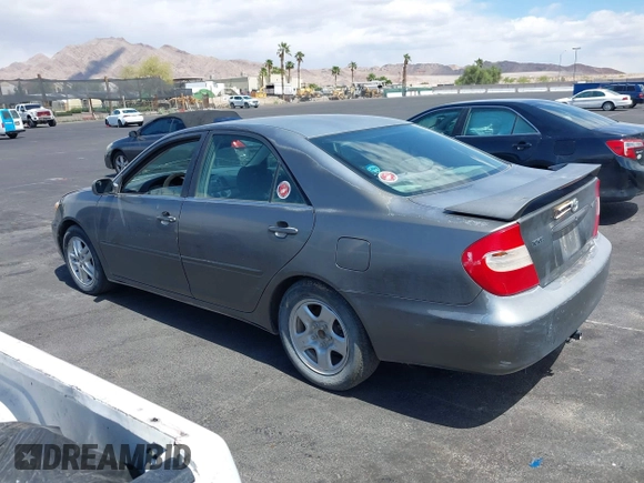2003 Toyota Camry LE with VIN JTDBE32K130149032, listed as a IAAI auction lot 42063174 with 241,424 mi miles and . Bid and sale history available at DreamBid. Image 3.