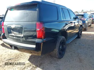 2015 Chevrolet Tahoe LT with VIN 1GNSCBKC5FR156050, listed as a IAAI auction lot 41486815 with 220,599 mi miles and . Bid and sale history available at DreamBid. Image 4.
