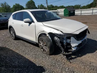2019 Mazda CX-5 Grand Touring with VIN JM3KFBDM2K1663140, listed as a Copart auction lot 61713755 with 68,101 mi miles and Salvage title. Bid and sale history available at DreamBid. Image 4.