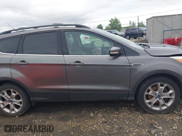 2013 Ford Escape SEL with VIN 1FMCU9HX4DUC75565, listed as a IAAI auction lot 42574351 with 180,876 mi miles and . Bid and sale history available at DreamBid. Image 14.
