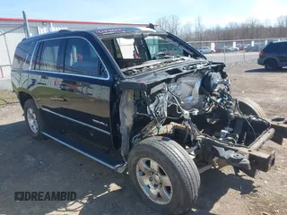 2015 GMC Yukon Denali with VIN 1GKS1CKJ3FR666601, listed as a IAAI auction lot 41946234 with 123,636 mi miles. Bid and sale history available at carsss.com. Image 1.