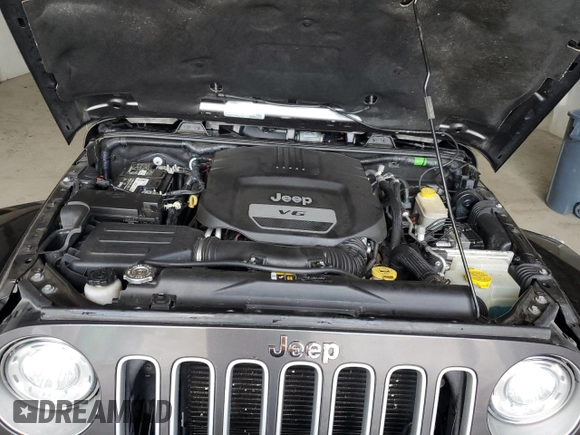 2017 Jeep Wrangler Sahara z VIN 1C4AJWBG6HL582839, wystawiony jako Copart lot #52049725 z przebiegiem 143 544 mil mil oraz Szkoda całkowita • Salvage title. Historia ofert i sprzedaży dostępna na DreamBid. Obrazek 12.