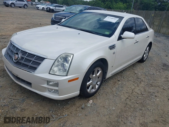 2010 Cadillac STS AWD z VIN 1G6DU6EV4A0102872, wystawiony jako IAAI lot #42348505 z przebiegiem 151 934 mil mil oraz . Historia ofert i sprzedaży dostępna na DreamBid. Obrazek 2.