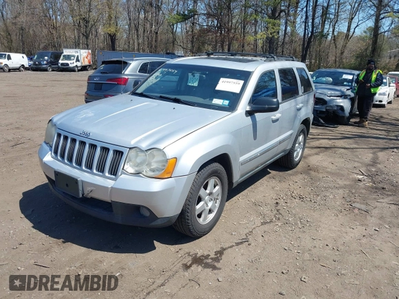 2010 Jeep Grand Cherokee Laredo with VIN 1J4PR4GKXAC141526, listed as a IAAI auction lot 41997559 with 0 mi miles. Bid and sale history available at carsss.com. Image 2.