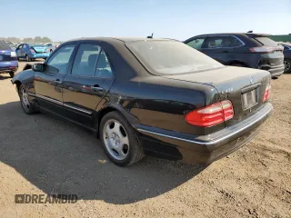 2002 Mercedes-Benz E-Class with VIN WDBJF70J22B489706, listed as a Copart auction lot 71109874 with 59,167 mi miles and Salvage Title. Bid and sale history available at carsss.com. Image 2.