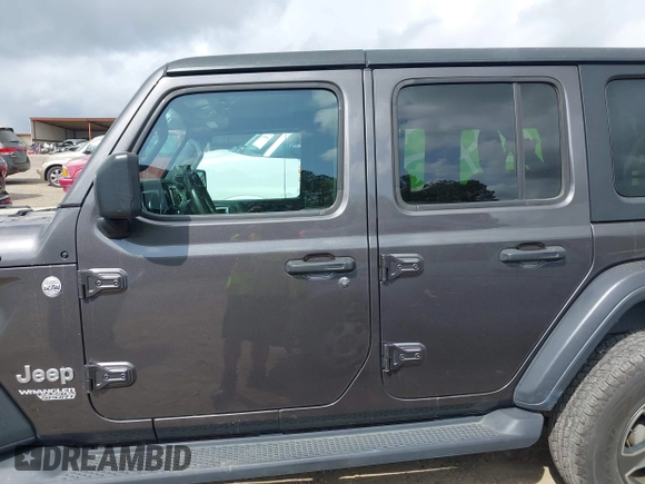 2018 Jeep Wrangler Unlimited Sport S z VIN 1C4HJXDG8JW112639, wystawiony jako IAAI lot #41951965 z przebiegiem 93 853 mil mil oraz . Historia ofert i sprzedaży dostępna na DreamBid. Obrazek 14.
